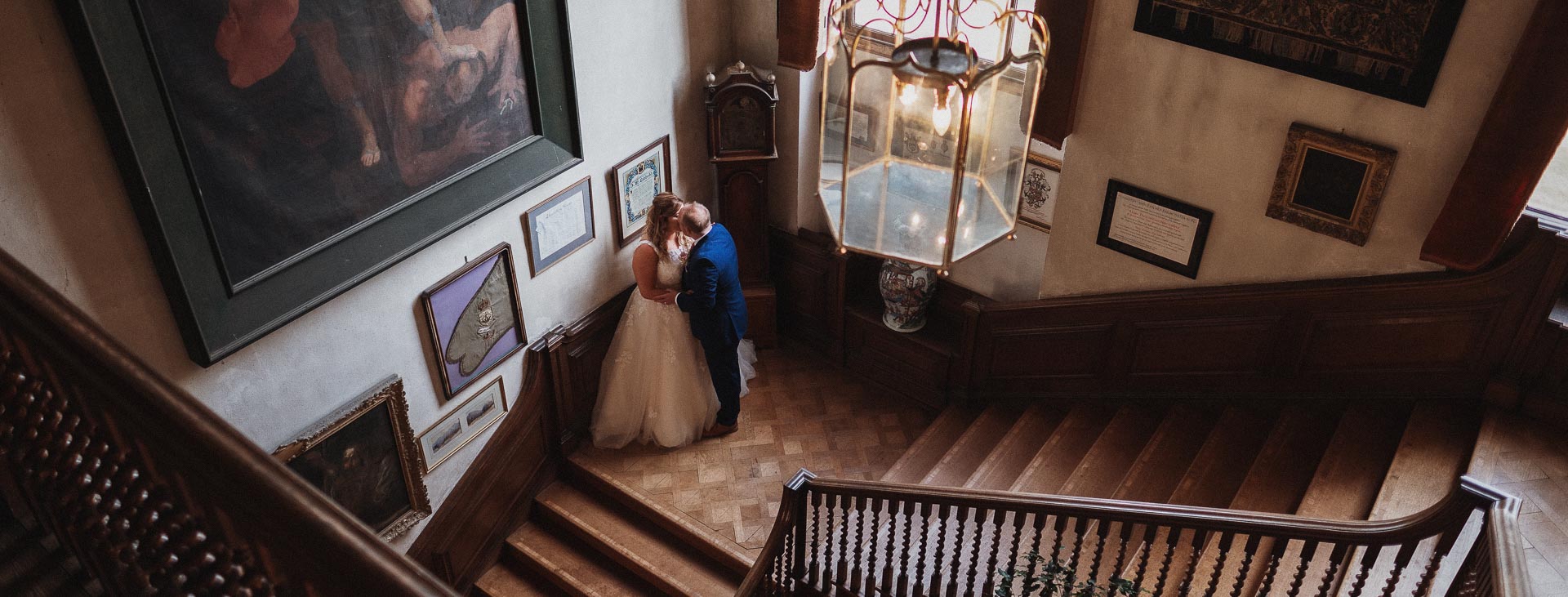 Couple share a kiss on a vintage staircase, Suffolk Wedding Photographer, Heffs Photography, 