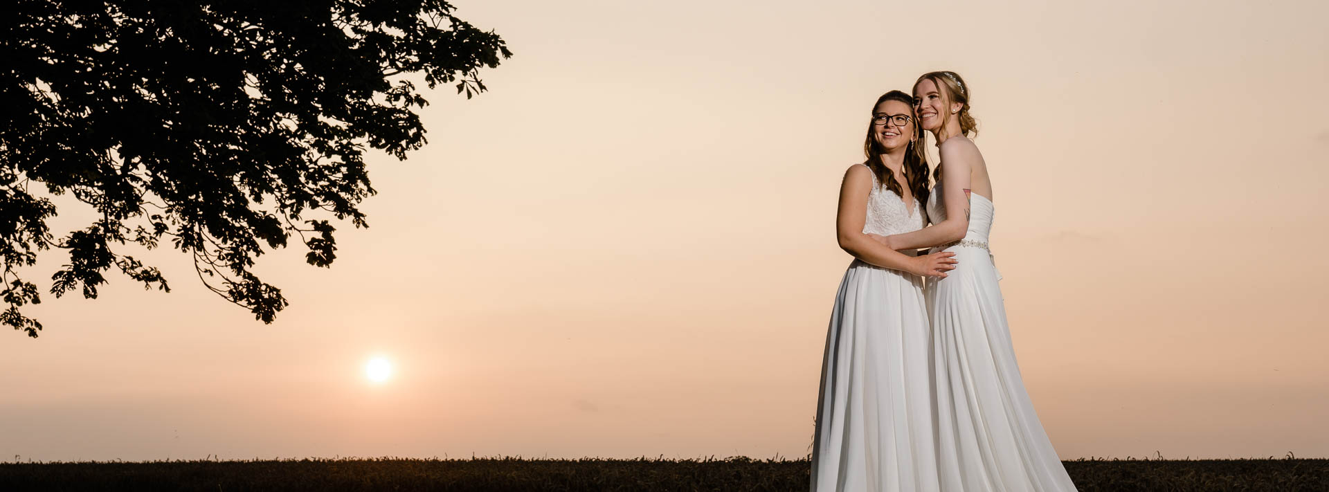 Brides sharing a cuddle against a sunset, All Manor of Events, Henley, Heffs Photography, 