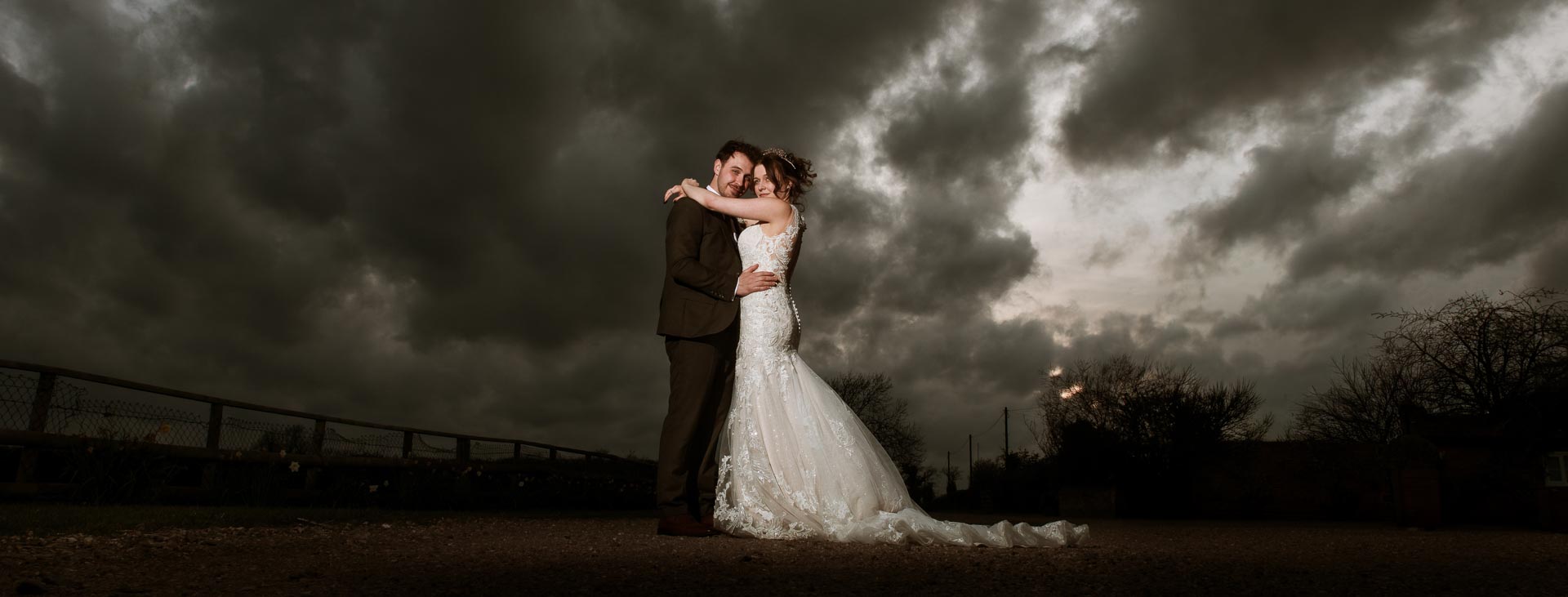 Bride and Groom with a moody sky, Suffolk Wedding Photographer, Heffs Photography,