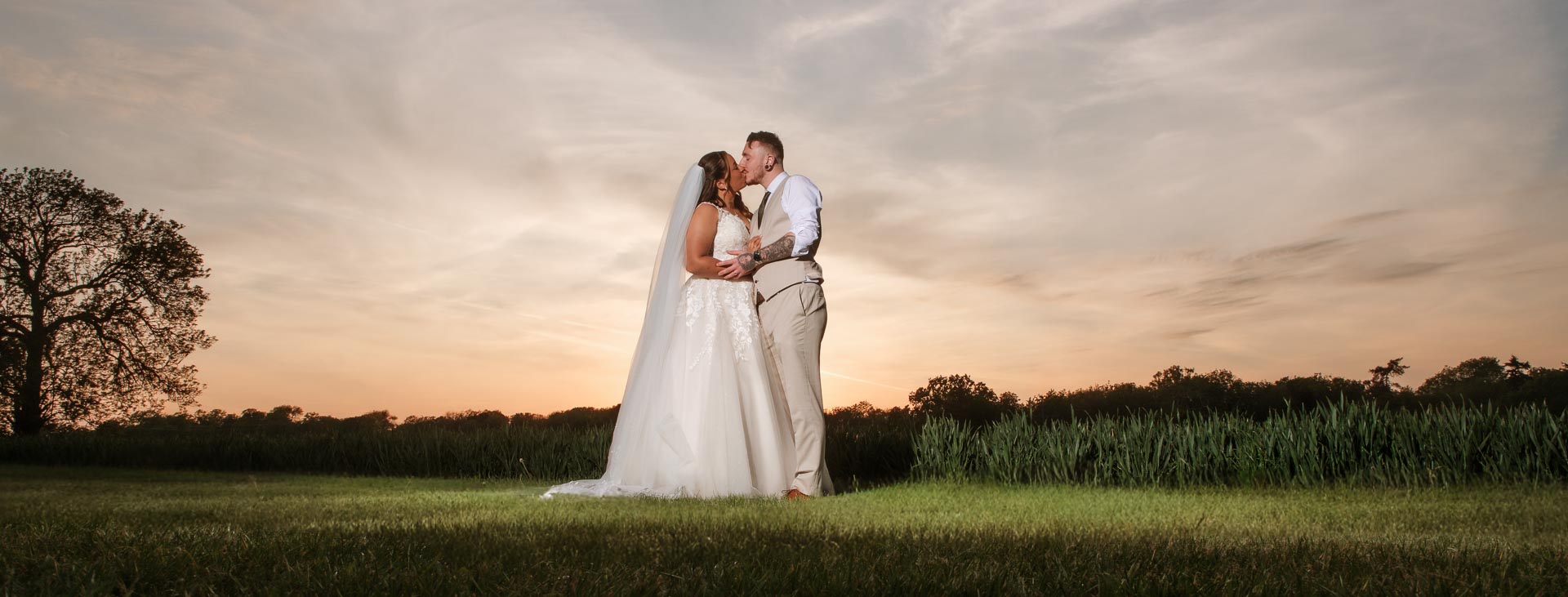 Married couple kissing with a beautiful sunset, Hintlesham Golf Club, Weddings, Heffs Photography, Suffolk Wedding Photographer, 