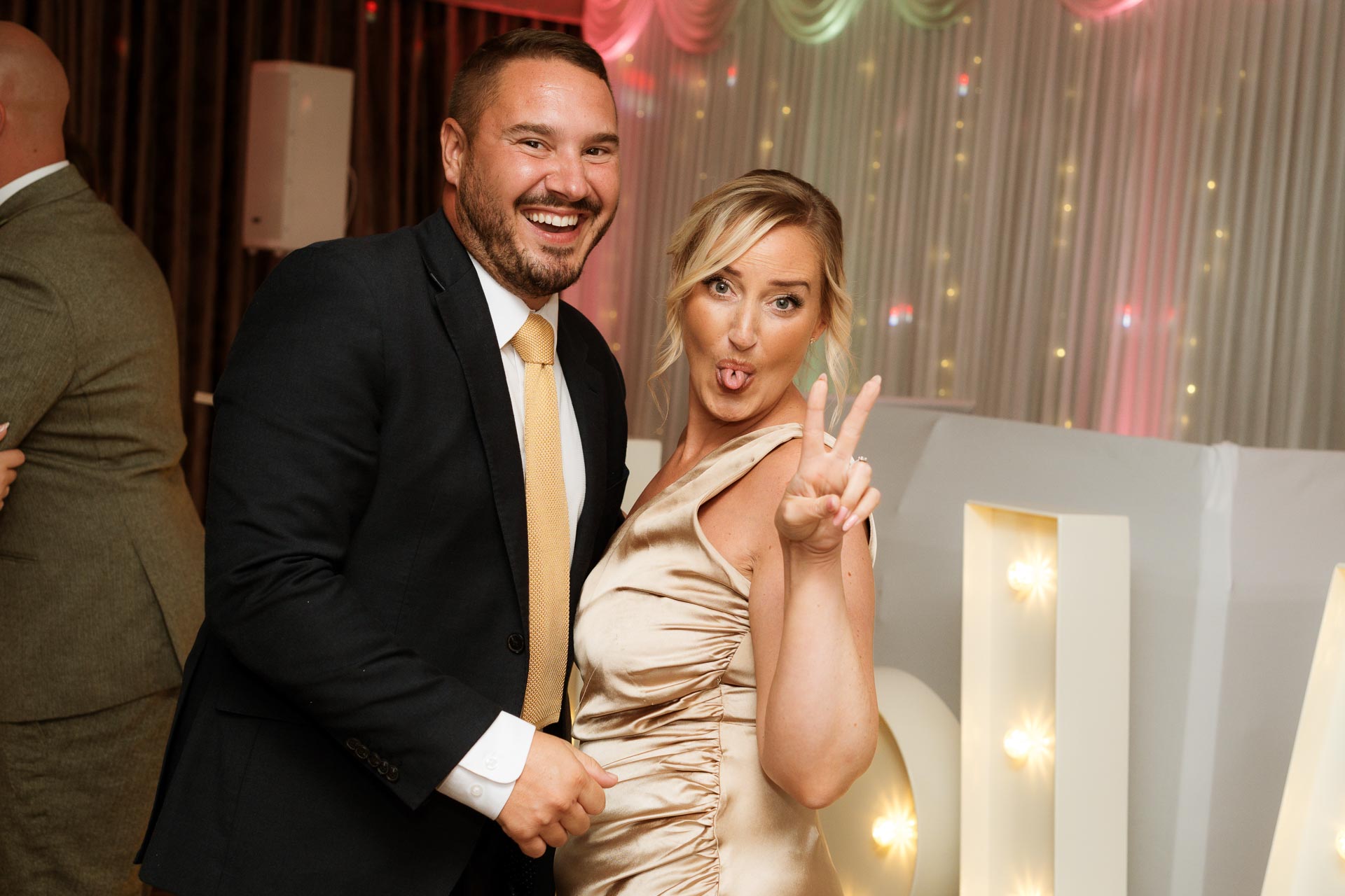woman giving a peace sign whilst on the dancefloor, Heffs Photography, 