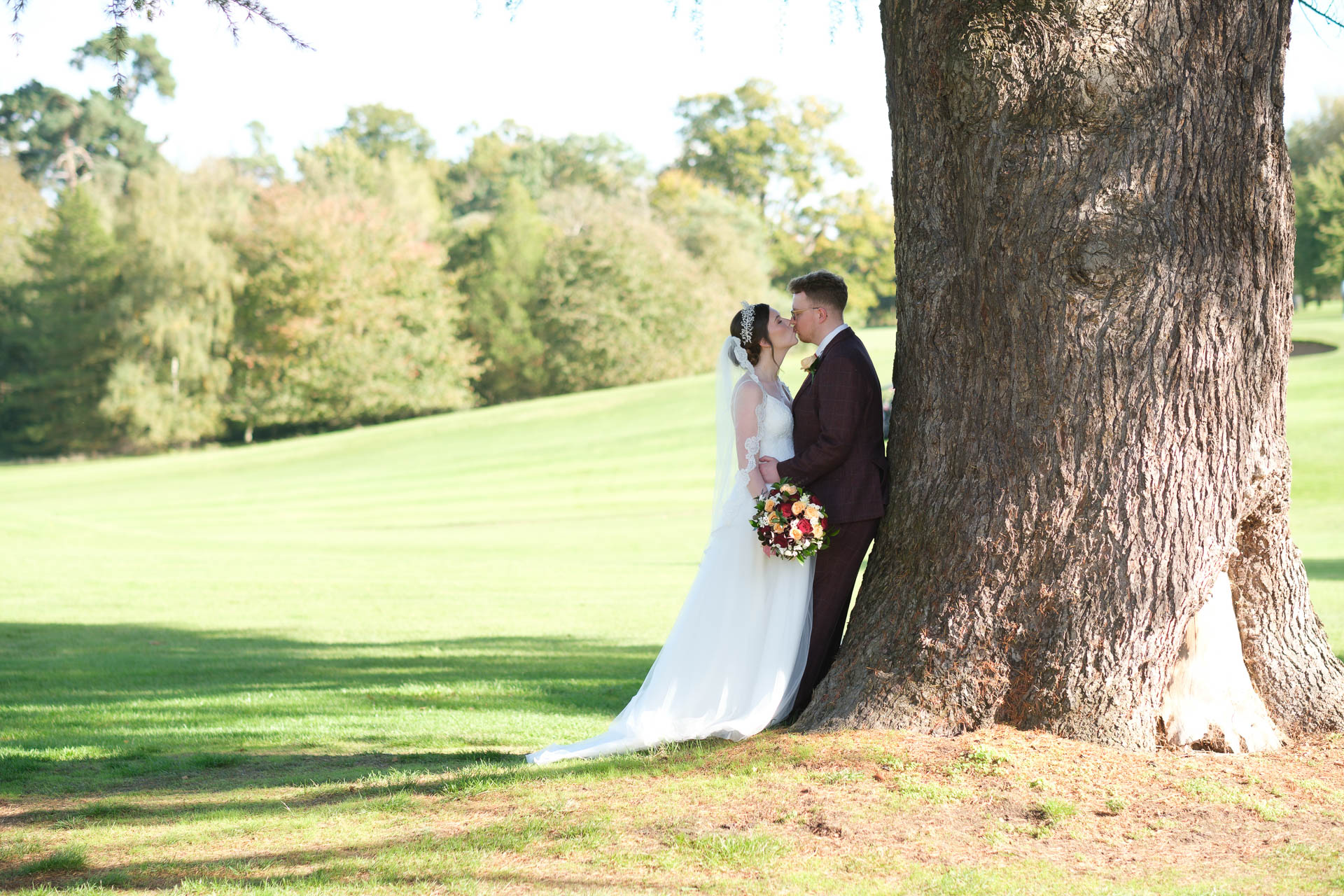 Couple kissing with a beautiful sunset at All Manor of Events Heffs Photography